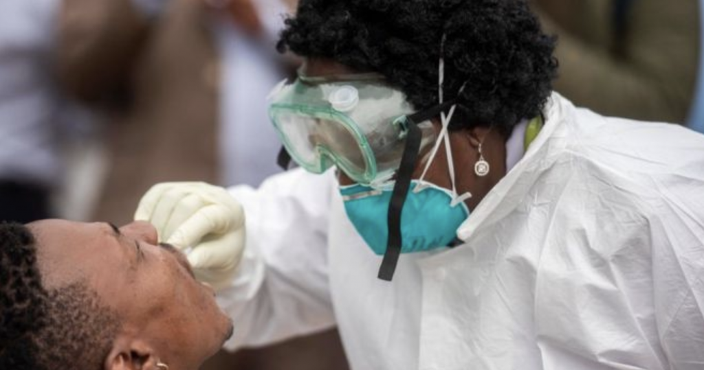Doctor conducting a COVID-19 swab test on a patient.