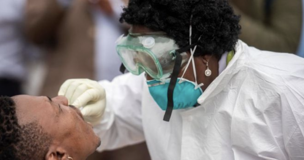 Doctor conducting a COVID-19 swab test on a patient. 