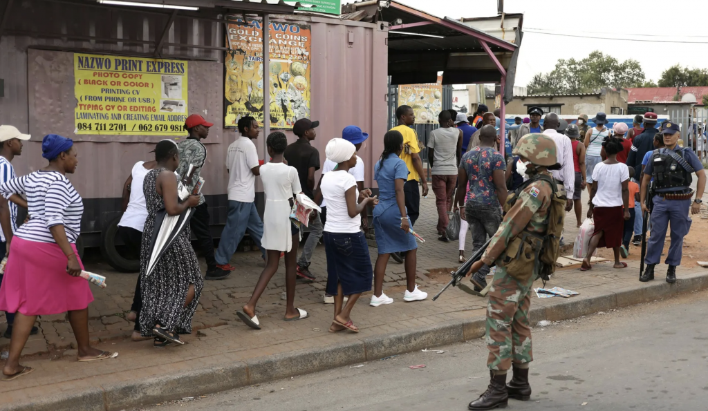 Image of police and military forces monitoring South Africans away in a bid to enforce lockdown regulations.