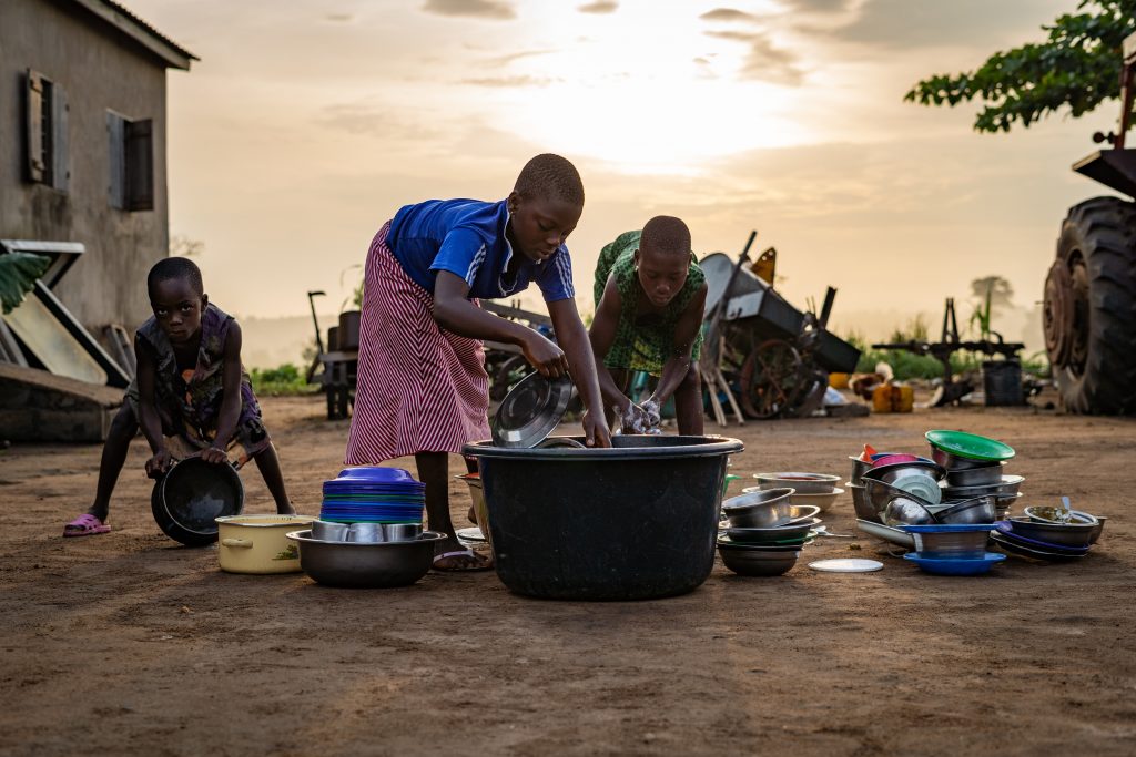 Children doing their dishes in Lome, Togo. 