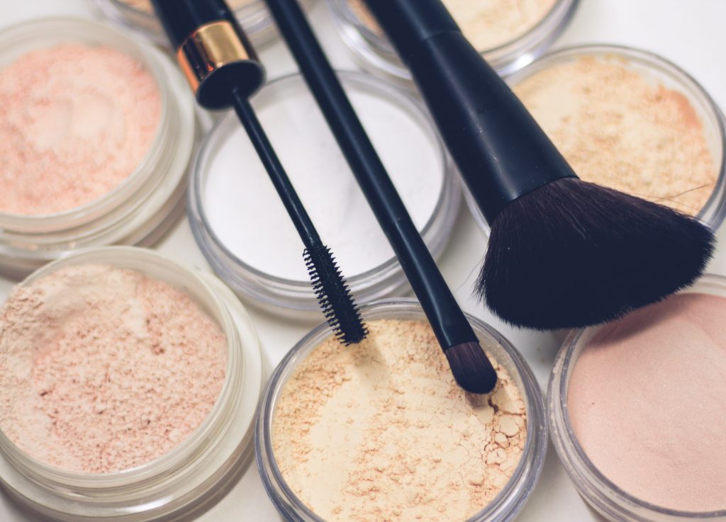 Image of make up powders, brushes and eyeliner