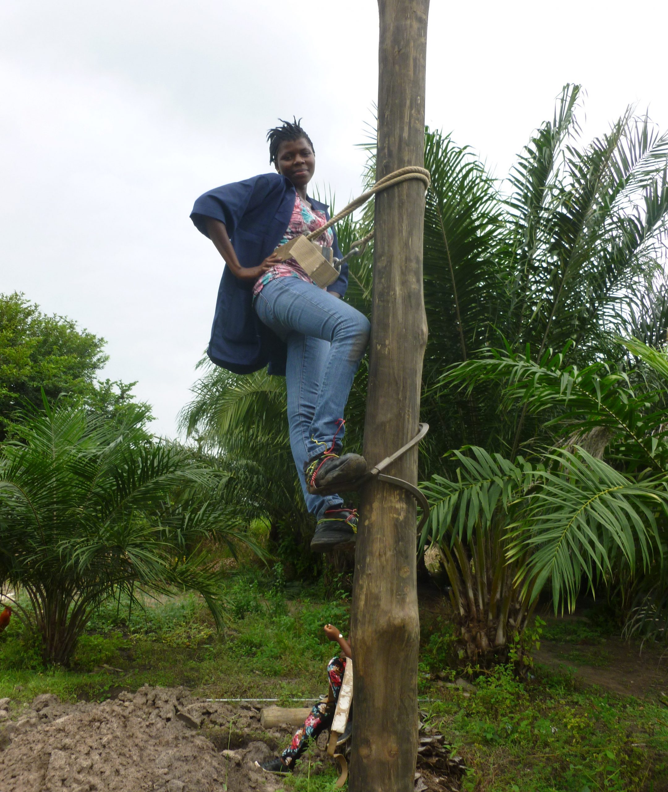 A female student recruited from a nearby village in Ho, Ghana. She can be seen on an electricity pole during her industrial attachment as part of her course, General Electricity.