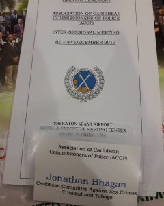 Image of a badge of Jonathan Bhagan at a meeting representing Caribbean Committee Against Sex Crimes 