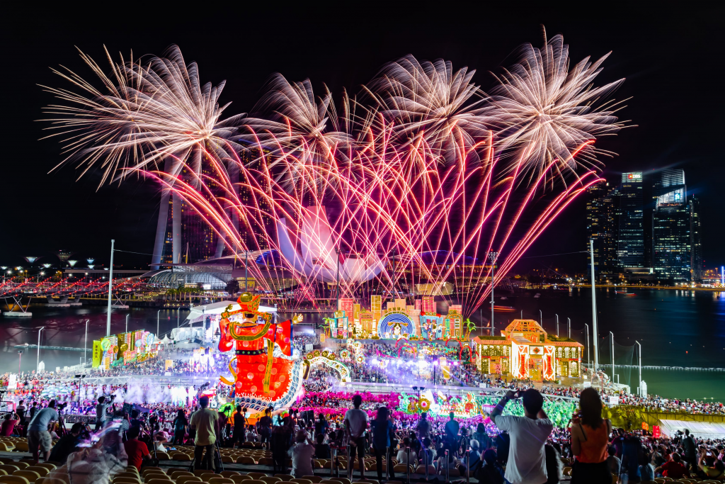 Image of people bursting firecrackers to celebrate the festival.