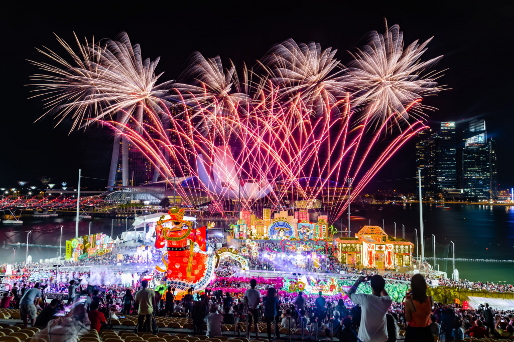 Image of people bursting firecrackers to celebrate the festival. 