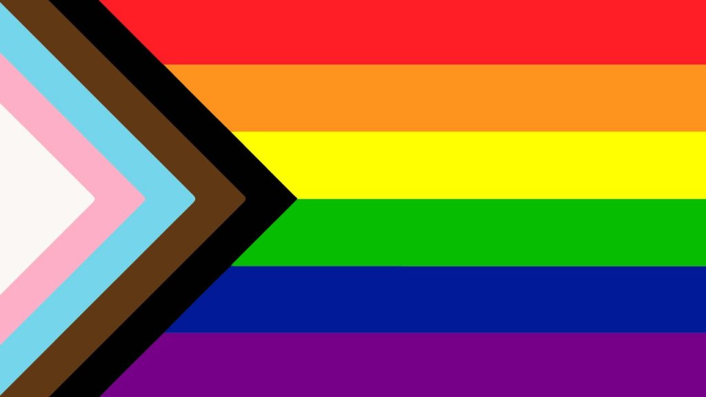 Pride flag that includes black, brown, blue, pink and white stripes in honor of the transgender community and people of color. 