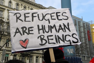 This image is from a peaceful protest for standing up with refugees and that refugees are human beings too!