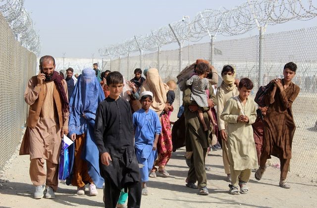 An image showing refugees going fleeing from the Taliban rule