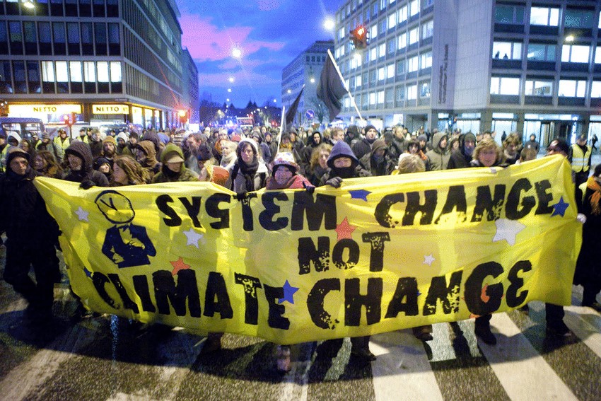 An image from a protest for System change and not Climate change