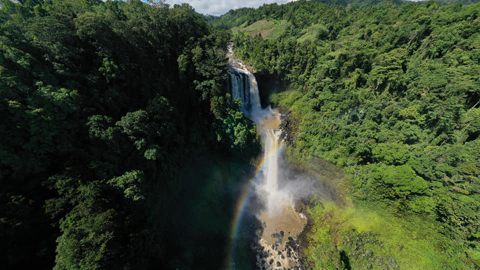 Image of Limunsudan Falls majestically flowing besides forest covers, a two-tiered waterfalls in the Philippiness