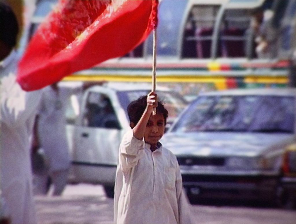 Iqbal Masih, a young child, joins a protest against bonded labour