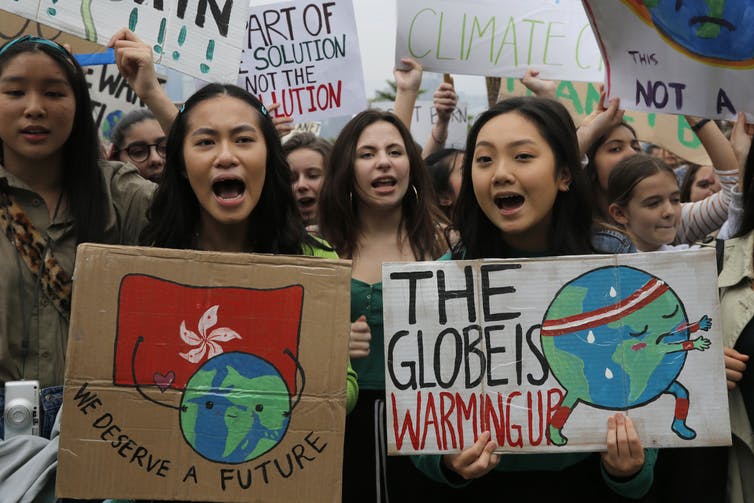 Image of young climate activists joining a protest