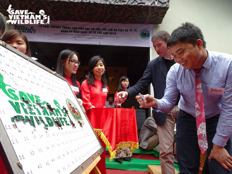 Nguyen Van Thai doing a puzzle in the opening ceremony of Vietnam’s first Carnivore and Pangolin Conservation Education Centre
