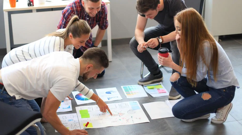 Young individuals amidst a brainstorming session