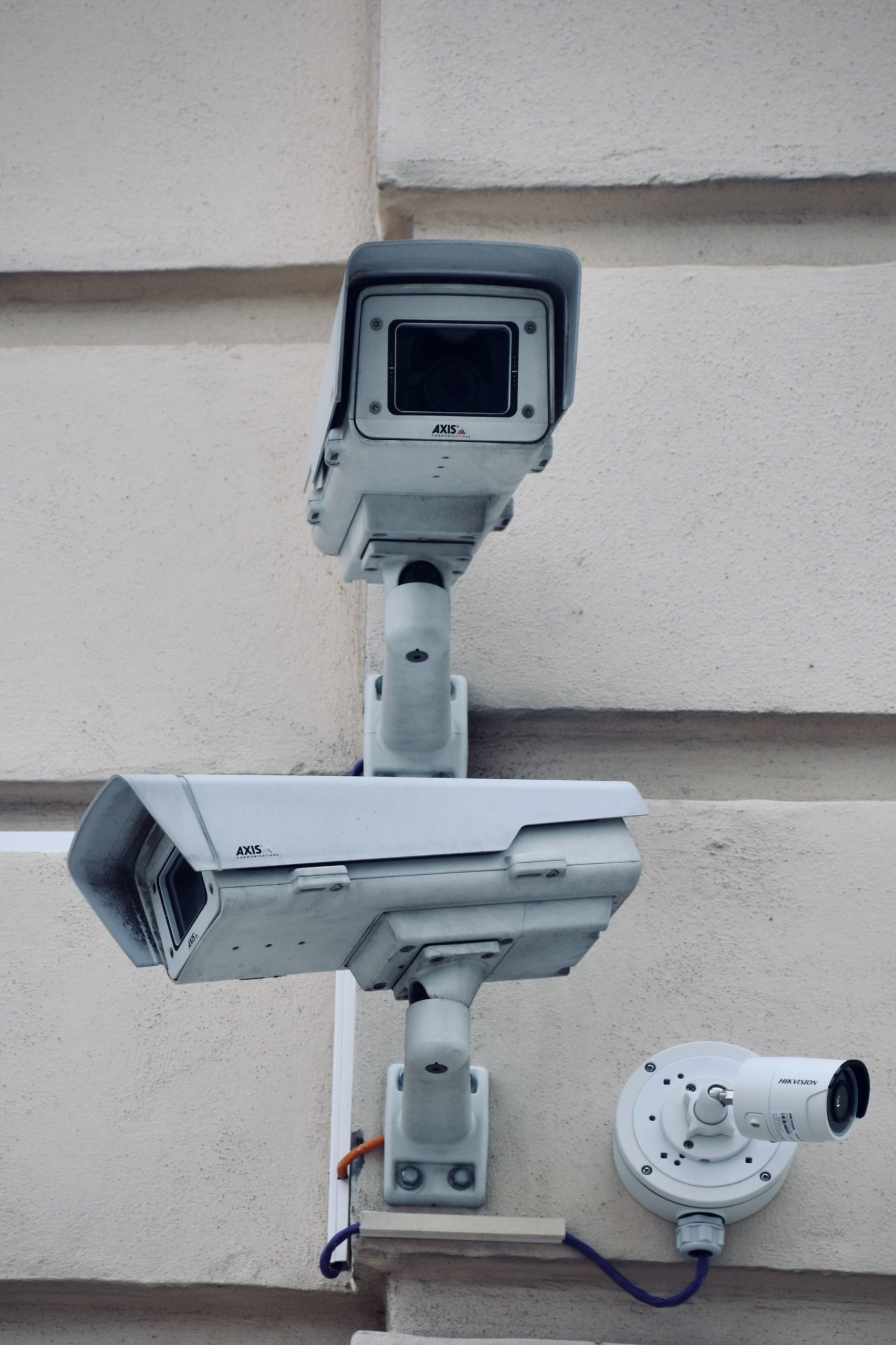 image of security cameras attached to a wall