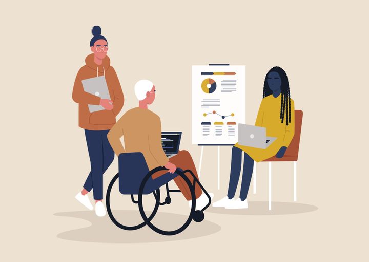 Two non-disabled people with a person in a wheelchair