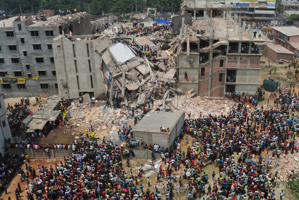 This image shows the unfortunate incident of Rana Plaza factory collapse in Bangladesh and the thousands of workers' families who have gathered to meet them.