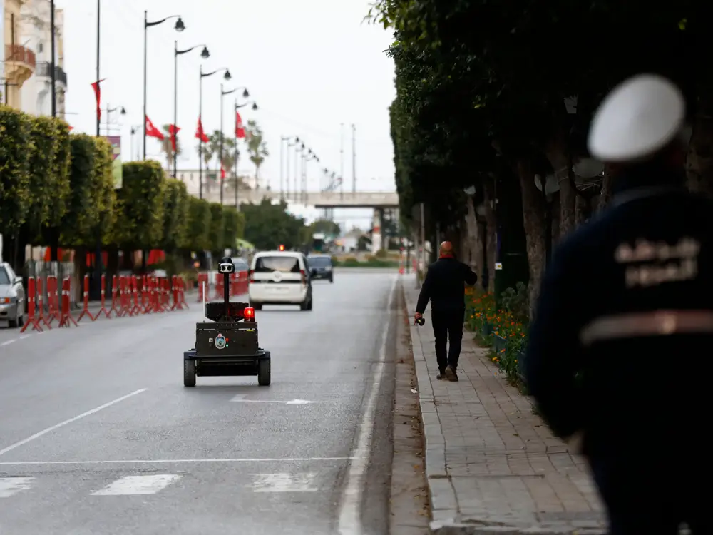 Empty Tunisian Streets guarded by the police and a PGuard Robot.