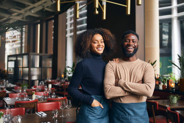 Cheerful small business partners in the restaurant