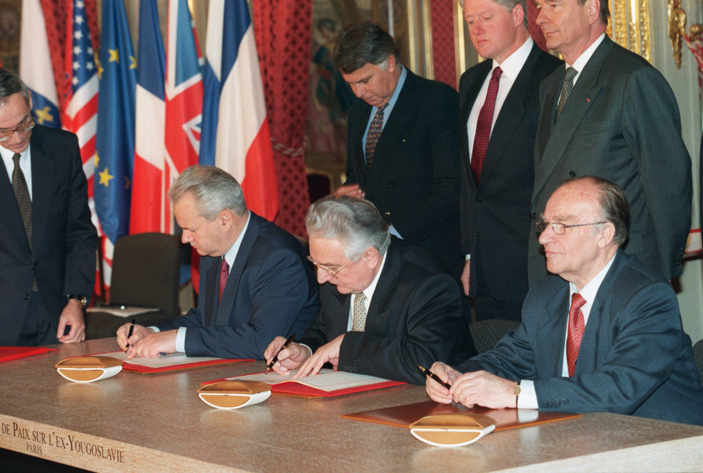 Men occupying seats in the peace processes. 