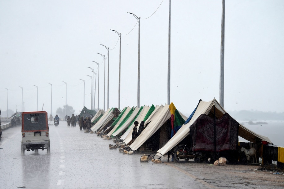 Make shift tents made on the side of the road as temporary shelter for flood victims.